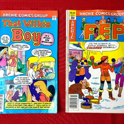 Sale Photo Thumbnail #751: Two vintage Archie Comics Group comic books, including That Wilkin Boy #49 and Pep #347, showing light wear along the spines and edges.