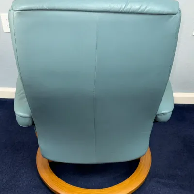 Sale Photo Thumbnail #234: Back view of a contemporary light blue leather reclining armchair with a circular bentwood wooden ring base.