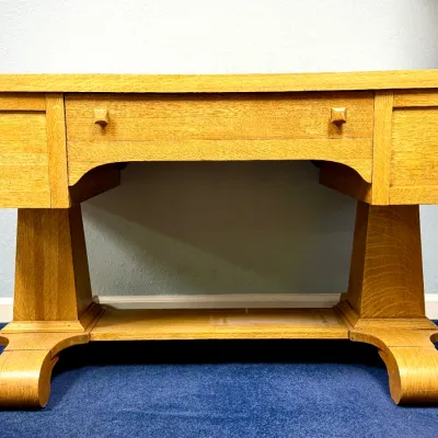 Sale Photo Thumbnail #680: Mission Arts and Crafts quarter-sawn oak console table with a single center drawer, lower shelf, and distinctive scroll feet.