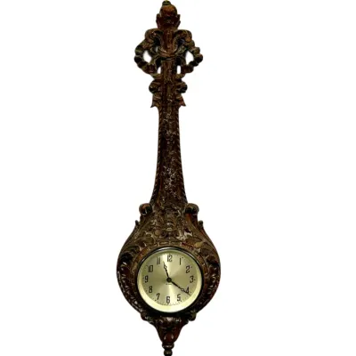 Sale Photo Thumbnail #28: Vintage Baroque-style carved wall clock featuring intricate scrollwork and a round, light-colored clock face.