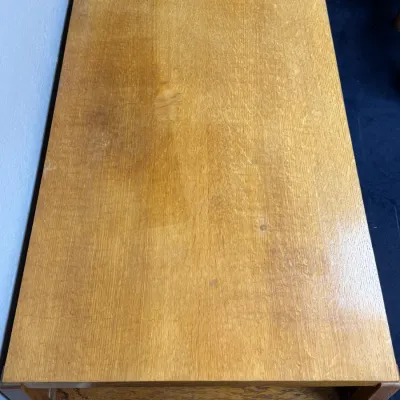 Sale Photo Thumbnail #687: Mid-century light oak coffee table or bench showing natural wood grain and light surface wear.