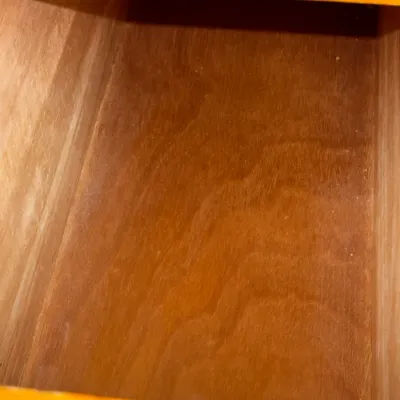 Sale Photo Thumbnail #212: Interior view of an empty wooden drawer showing clean grain finish and dovetail-style construction.