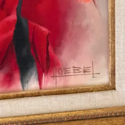 Sale Photo Thumbnail #160: Close-up detail of an original painting in vibrant red tones, showing the artist signature 'HOEBEL' in the lower corner and a gold-toned frame with a linen liner.