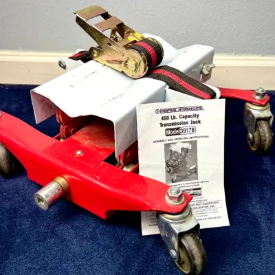 Sale Photo Thumbnail #43: Central Hydraulics 450 lb. capacity transmission jack (Model 39178) with ratchet strap and original instruction manual.