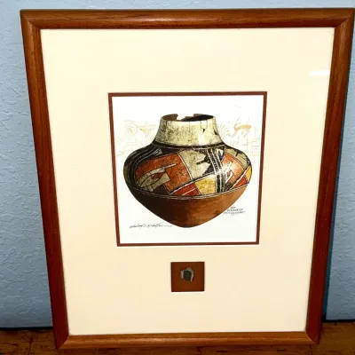 Sale Photo Thumbnail #483: Framed artwork depiction of a San Bernardo Polychrome pot, featuring double matting, a wooden frame, and a mounted artifact shard below the image.