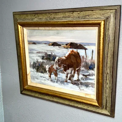 Sale Photo Thumbnail #34: Framed oil painting depicting a cow and calf in a snowy landscape, signed by H. Budge in the lower right corner.
