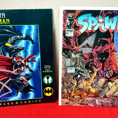 Sale Photo Thumbnail #803: Two 1990s comic books featuring Spawn, including Spawn/Batman graphic novel by Frank Miller and Todd McFarlane alongside Spawn issue #36.