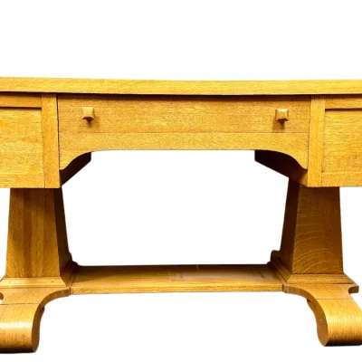 Sale Photo Thumbnail #62: Arts and Crafts style light oak console desk or vanity featuring a central drawer with wooden knobs and trestle-style legs.