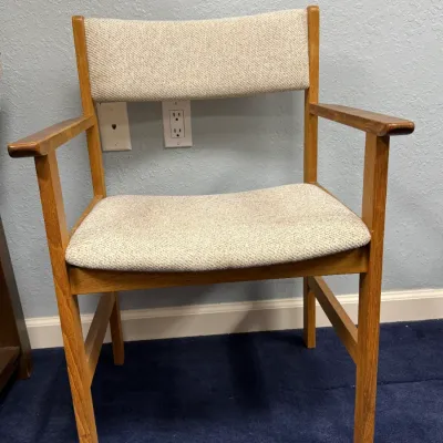 Sale Photo Thumbnail #695: Mid-century modern oak armchair with light beige tweed upholstery.