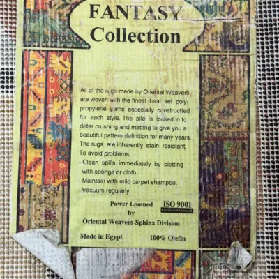 Sale Photo Thumbnail #714: Original manufacturer tag for an Oriental Weavers Fantasy Collection power-loomed 100% olefin rug, made in Egypt.