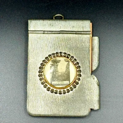 Sale Photo Thumbnail #10: Antique metal souvenir notebook pendant with miniature pencil holder, featuring a round glass photo insert of Stand Rock at Dells of the Wisconsin River.