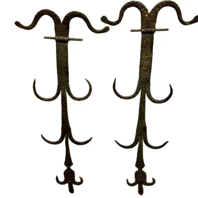 Sale Photo Thumbnail #57: Pair of vintage hand-hammered wrought iron strap hinges with ornate scroll details and fleur-de-lis ends.