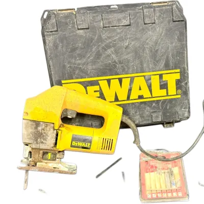 Sale Photo Thumbnail #51: DeWalt corded orbital jig saw with its original hard plastic carrying case and an assortment of blades.