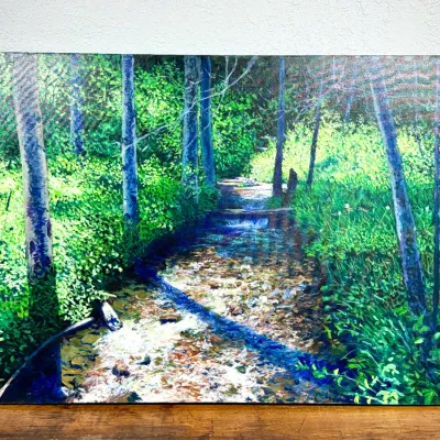 Sale Photo Thumbnail #470: Large unframed canvas painting depicting a sunlit forest stream surrounded by lush green foliage.