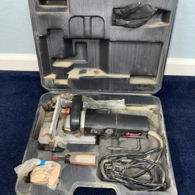Sale Photo Thumbnail #629: Freud brand biscuit joiner power tool set in a black blow-molded plastic hard carrying case, complete with power cord, accessories, and wooden biscuits.