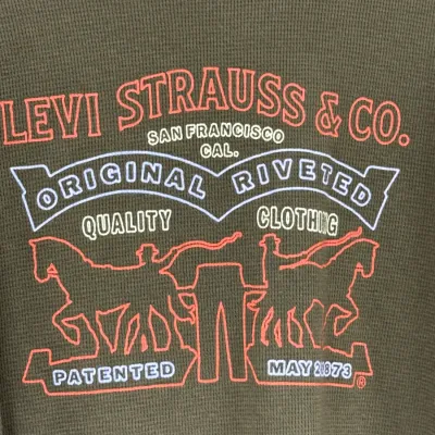 Sale Photo Thumbnail #887: Olive green thermal waffle-knit shirt featuring a Levi Strauss & Co. graphic logo on the chest.