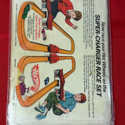 Sale Photo Thumbnail #785: Vintage Hot Wheels Super-Charger Race Set back cover comic book advertisement, circa 1969, featuring illustrated race track graphics.