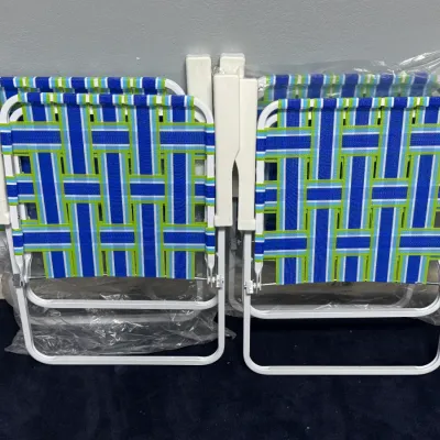 Sale Photo Thumbnail #918: Set of four folded lawn chairs with white aluminum frames and blue and green plaid woven webbing.