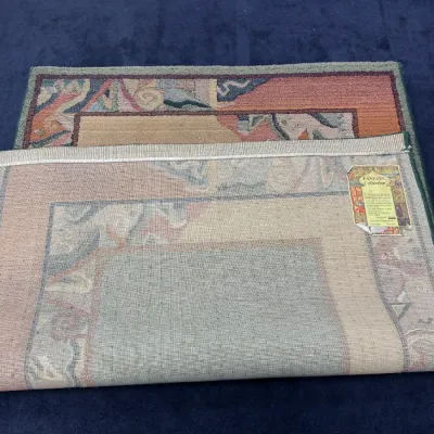 Sale Photo Thumbnail #713: Oriental Creative Creation Fantasy Collection wool area rug featuring a colorful Southwest or abstract motif, shown with corner folded back to display original maker's tag.