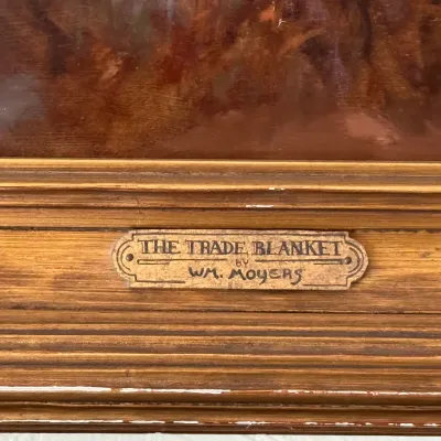 Sale Photo Thumbnail #103: Framed artwork title plaque reading "The Trade Blanket by Wm. Moyers" attached to a molded wood frame with slight edge wear.