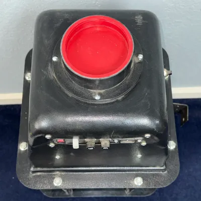 Sale Photo Thumbnail #541: Vintage black industrial projector or enlarger housing featuring a red lens cap and front control switches.