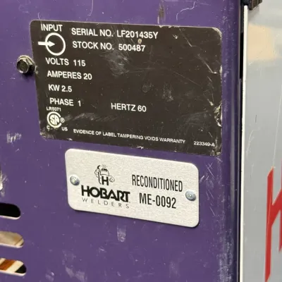 Sale Photo Thumbnail #503: Identification and reconditioned specification plates on a purple Hobart welder, model ME-0092.