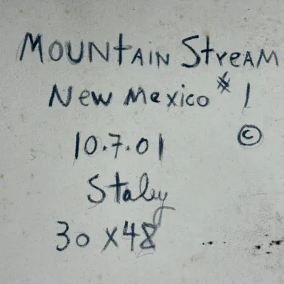 Sale Photo Thumbnail #479: Handwritten title and signature details on the back of a canvas painting titled 'Mountain Stream New Mexico #1', dated October 7, 2001, by Staley.