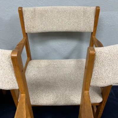 Sale Photo Thumbnail #693: Mid-century modern style wooden armchair featuring textured beige tweed upholstery and a light oak frame.