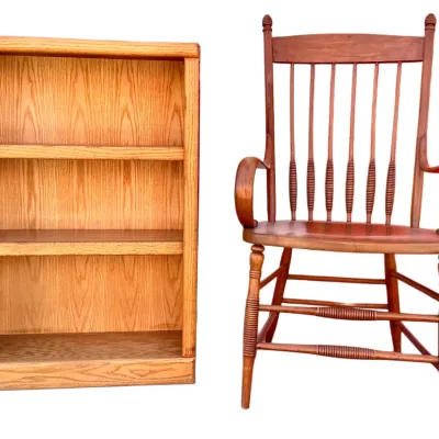 Sale Photo Thumbnail #64: Small three-shelf oak bookcase paired with a vintage wooden Windsor-style armchair featuring spindle back detailing.