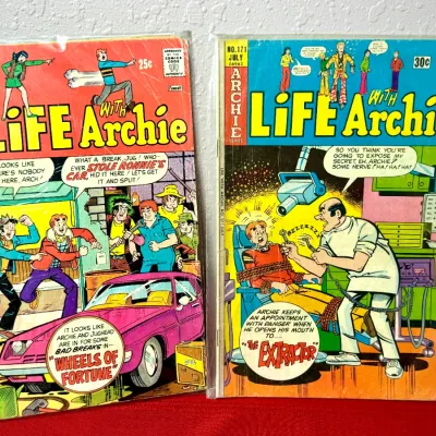 Sale Photo Thumbnail #753: Two vintage Life With Archie comic books, including issue #156 from April and issue #171 from July, both protected in plastic sleeves.