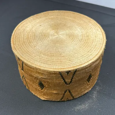 Sale Photo Thumbnail #389: Finely woven African raffia kufi cap featuring dark geometric patterns along the side band.