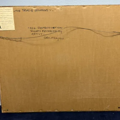 Sale Photo Thumbnail #114: Back side of framed artwork titled "The Trade Blanket" by William Moyers, featuring handwritten title, artist signature, copyright notation, and gallery labels.