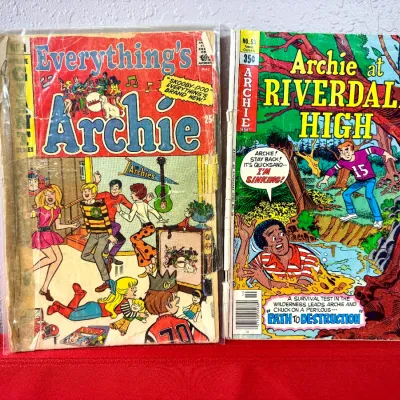 Sale Photo Thumbnail #747: Two vintage Archie comic books, including Everything's Archie and Archie at Riverdale High #58, showing heavy cover wear and aging.