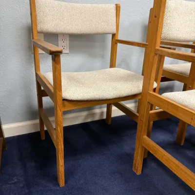Sale Photo Thumbnail #691: Set of mid-century modern style wooden armchairs with light beige woven upholstery.