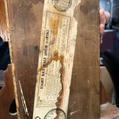 Sale Photo Thumbnail #375: Vintage Seth Thomas clock back wooden panel with original paper instruction and movement label intact.