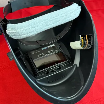 Sale Photo Thumbnail #518: Chicago Electric auto-darkening welding helmet with adjustable headgear and padded forehead band.