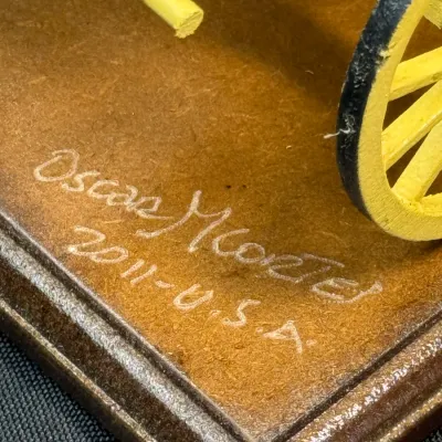 Sale Photo Thumbnail #494: Handcrafted miniature wagon on a wooden base, signed 'Oscar Morte 2011 - U.S.A.'