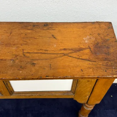 Sale Photo Thumbnail #278: Rustic antique wooden bench top showing heavy distressing, scratches, and a rich warm patina.