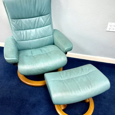 Sale Photo Thumbnail #222: Ekornes Stressless reclining armchair and matching ottoman in teal green leather with a circular bentwood base.