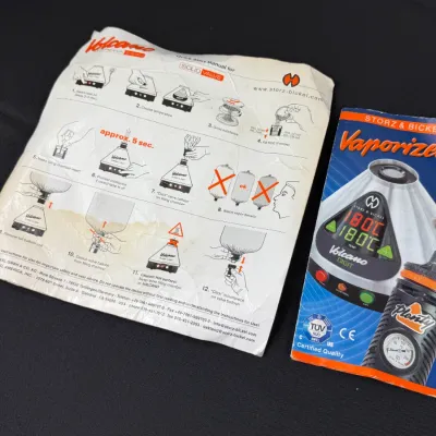 Sale Photo Thumbnail #842: Storz & Bickel instruction manuals for Volcano Digit and Plenty vaporizers, showing light creasing and wear.
