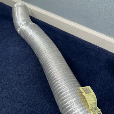 Sale Photo Thumbnail #546: Flexible aluminum dryer transition duct with original product label attached.