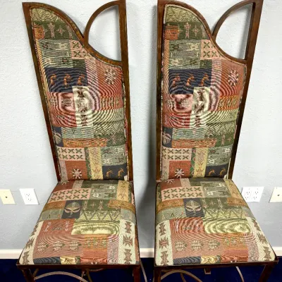Sale Photo Thumbnail #303: Pair of high-back accent chairs with sculptural wooden frames and Southwestern-style patterned tapestry upholstery.