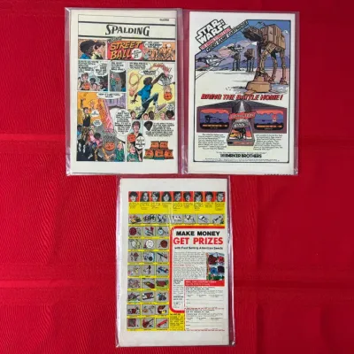 Sale Photo Thumbnail #771: Trio of vintage comic books in protective plastic sleeves, showing back-cover advertisements including Star Wars video games and American Seeds sales.