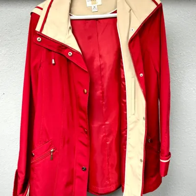 Sale Photo Thumbnail #891: Red hooded jacket with beige lining by Gallery, size medium, featuring snap and zipper closures.