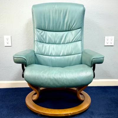 Sale Photo Thumbnail #223: Ekornes Stressless recliner armchair in teal green leather with a light bentwood swivel ring base.