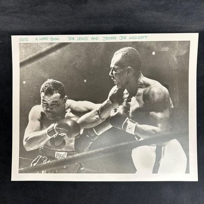 Sale Photo Thumbnail #471: Boxing Action Analog Photograph Joe Louis and Jersey Wolcott A Hard Blow
