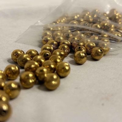 7 Plus Ounces of Gold Toned Textured Costume Jewelry Beads