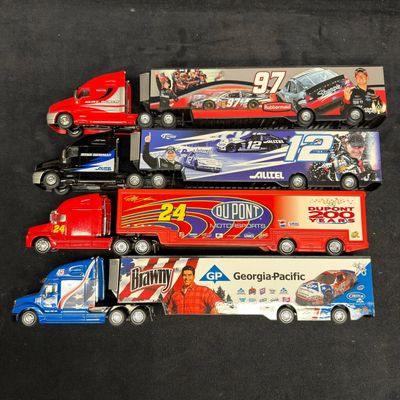 Sale Photo Thumbnail #403: Four NASCAR Diecast Transporter Trucks Gordon Newman Busch and Petty
