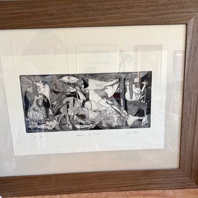 Framed print featuring Pablo Picasso's Guernica, numbered 36/100 and signed.