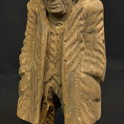 Pearson, Anton (1892-1967) man in overcoat, woodcarving